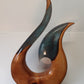 Kauri and resin hei matau sculpture