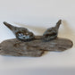 Ceramic birds on driftwood