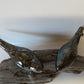 Ceramic birds on driftwood