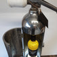 Whiskey bottle holder/fire extinguisher